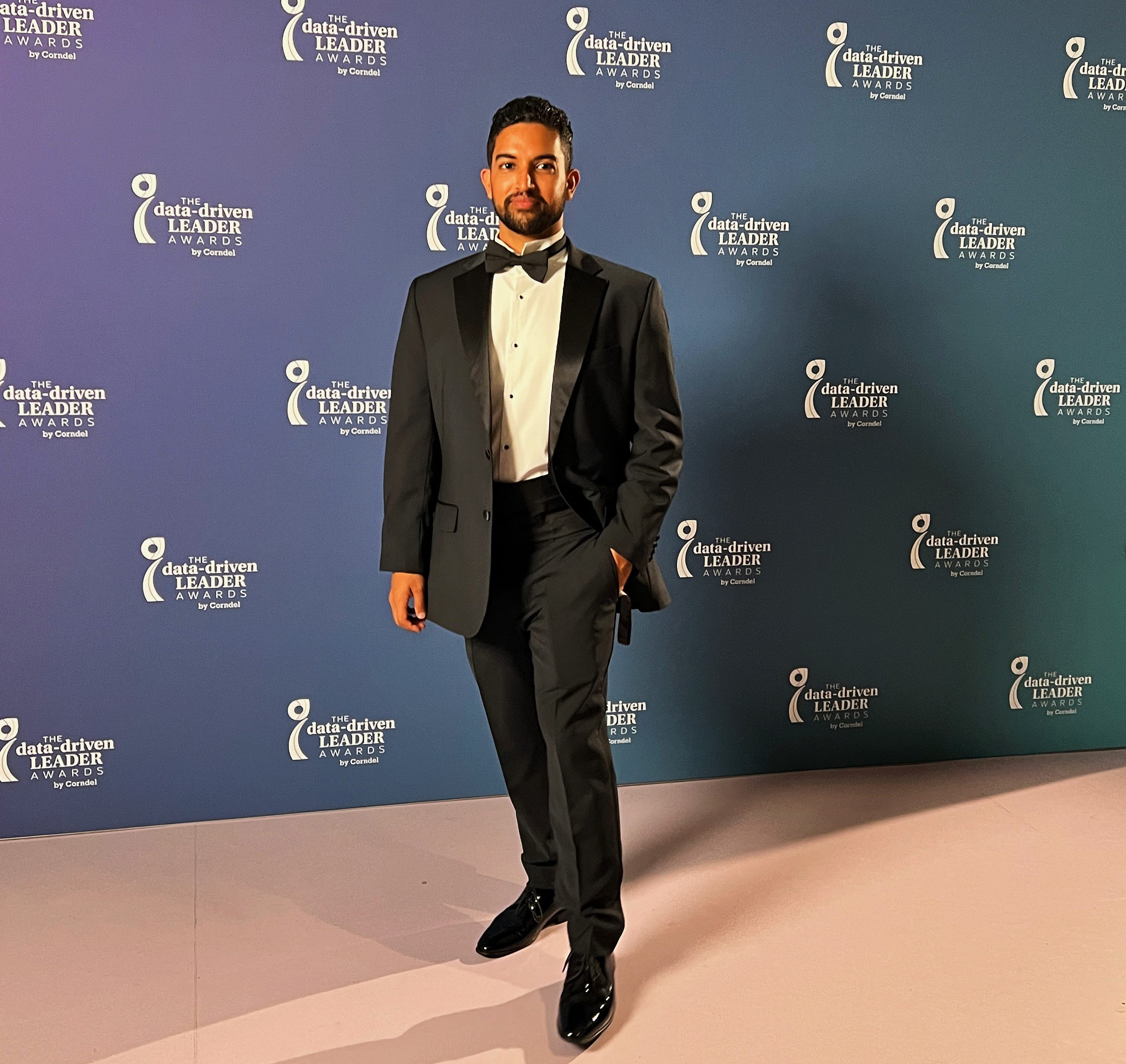 Sami Rahman in tuxedo on red carpet